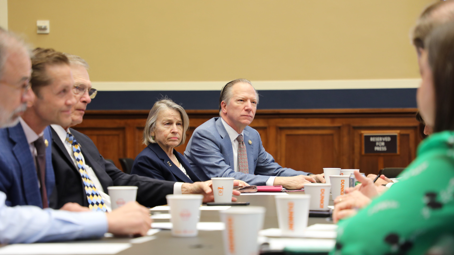 Members of the caucus in a meeting